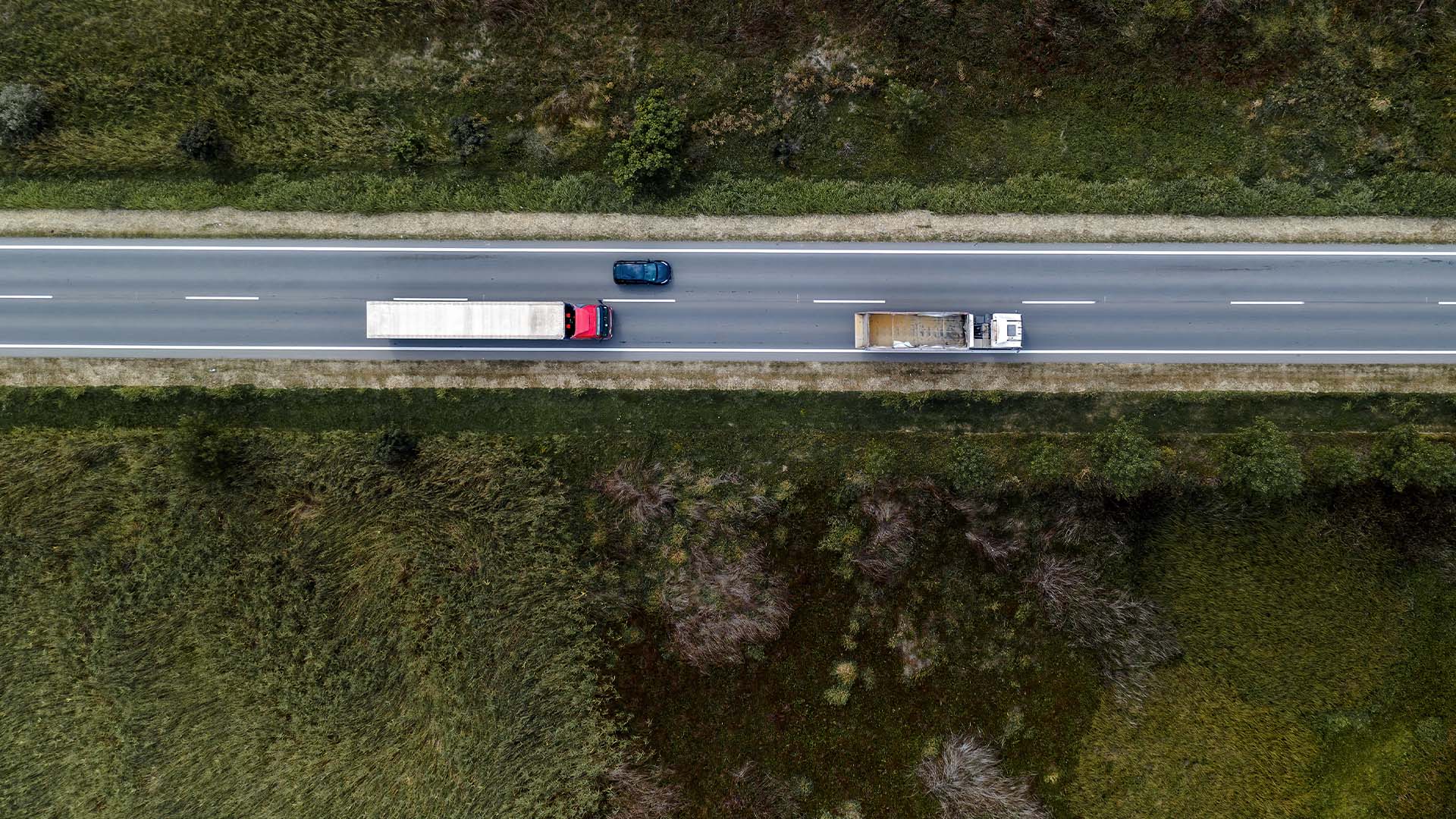 arial photo of 2 truck on road